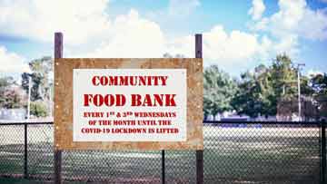 A sign reading:'COMMUNITY FOOD BANK Every 1st & 3rd Wednesdays of the month until the COVID-19 lockdown is lifted'