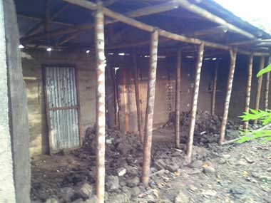 The inside of don Joselito's shanty. Only 3 walls are standing and some guadua bamboo poles